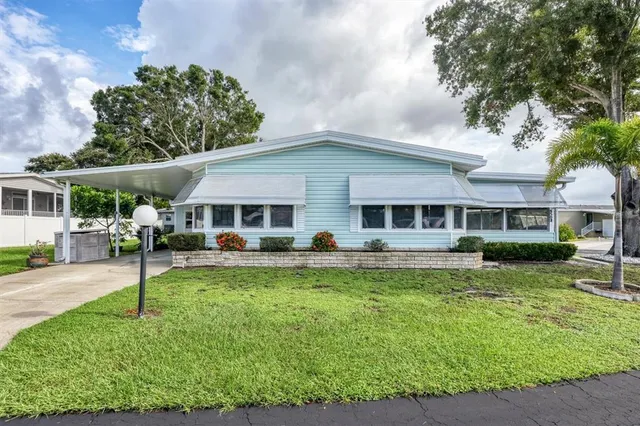 a front view of a house with swimming pool and porch