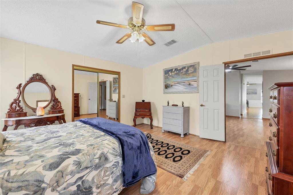 3502 Rita Place Ellenton, FL 34222 - Photo 22 of 46 a bedroom with a bed mirror and a table