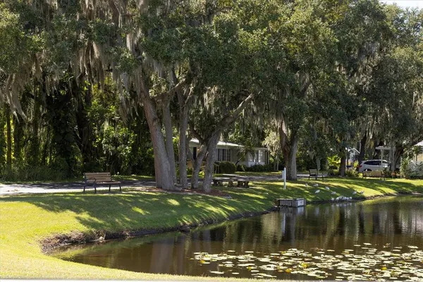 a view of swimming pool with yard