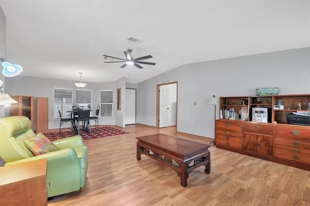 a living room with furniture and a table