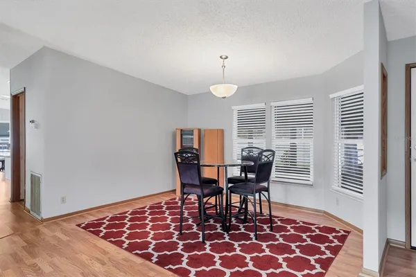 a view of a dining room with furniture