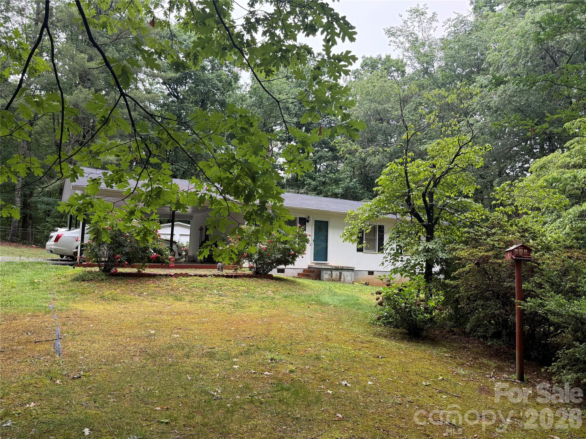 580 Legion Road Lenoir, NC 28645 - Photo 1 of 22 a view of a house with a garden