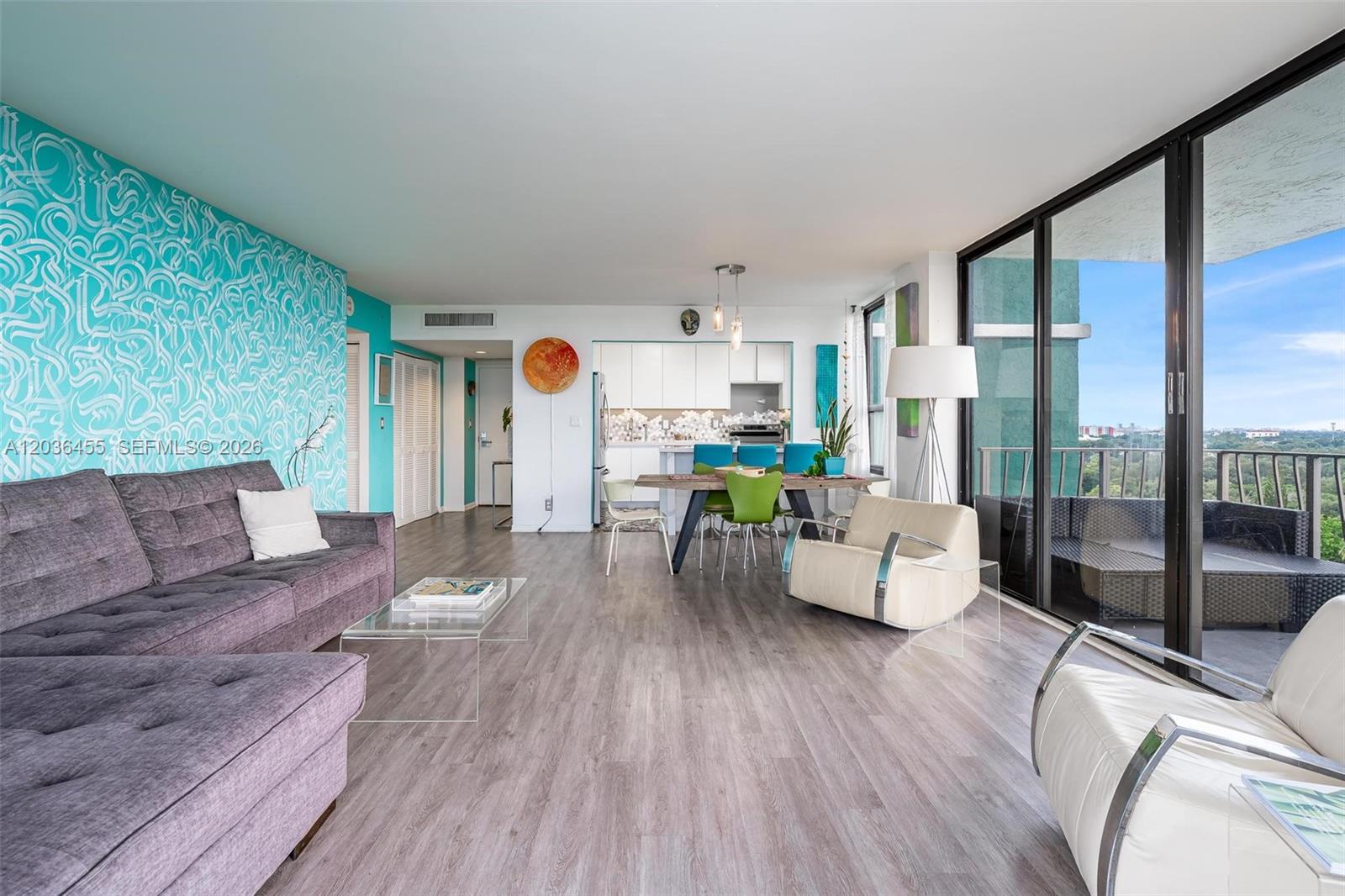 780 Northeast 69th Street, Unit 1010 Miami, FL 33138 - Photo 8 of 31 a living room with furniture and a large window