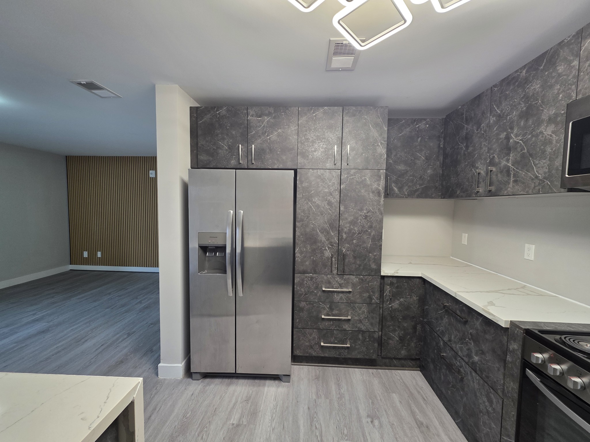 543 Peachers Mill Road Clarksville, TN 37042 - Photo 11 of 29 a kitchen with granite countertop a refrigerator and a sink