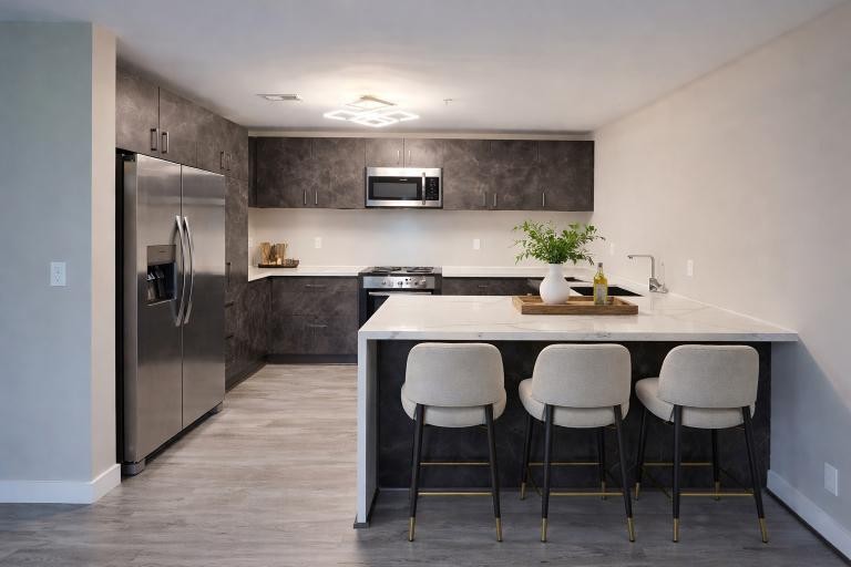 543 Peachers Mill Road Clarksville, TN 37042 - Photo 7 of 29 a kitchen with stainless steel appliances granite countertop a table chairs sink and cabinets