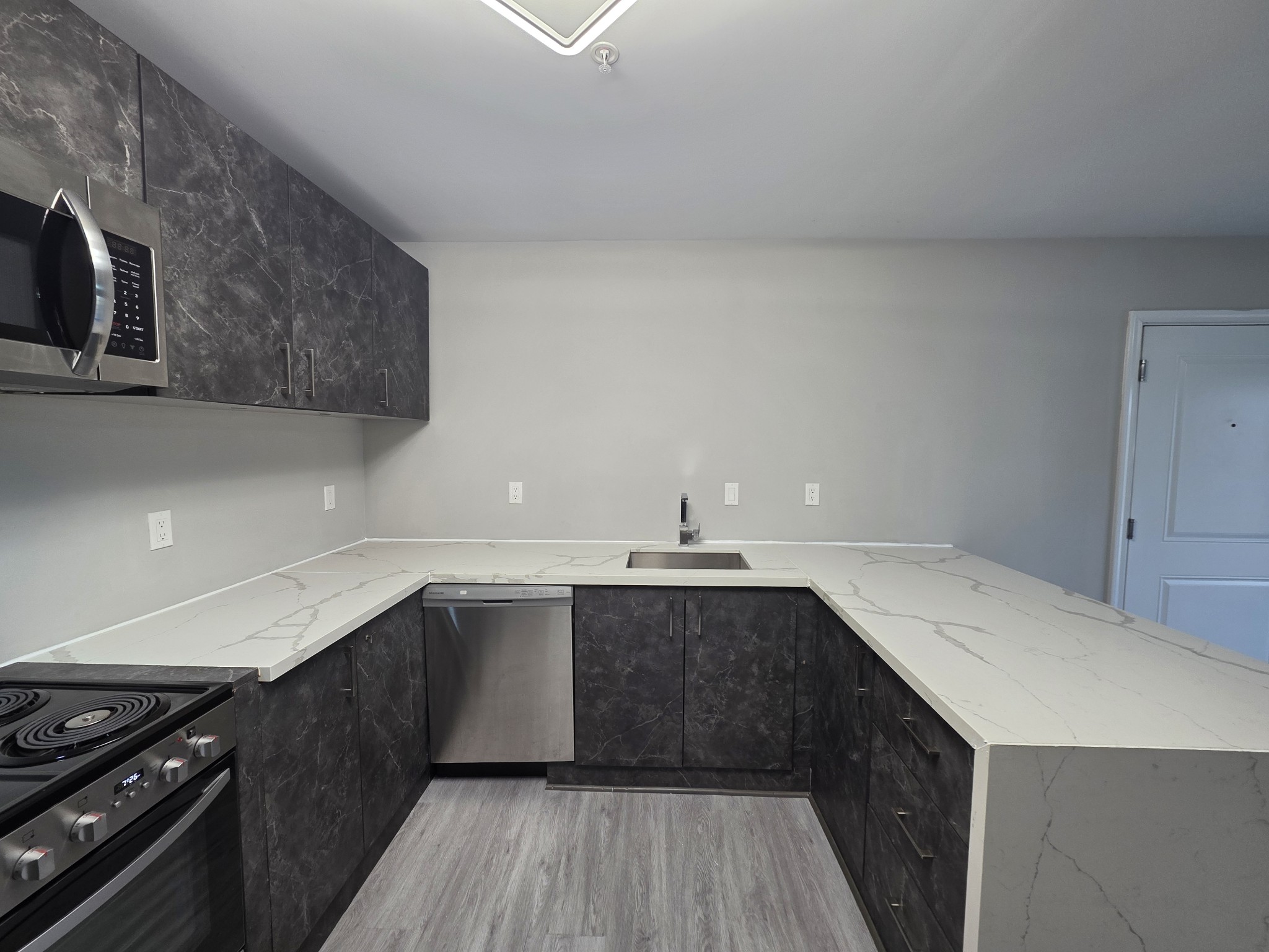 543 Peachers Mill Road Clarksville, TN 37042 - Photo 8 of 29 a kitchen with a sink and cabinets