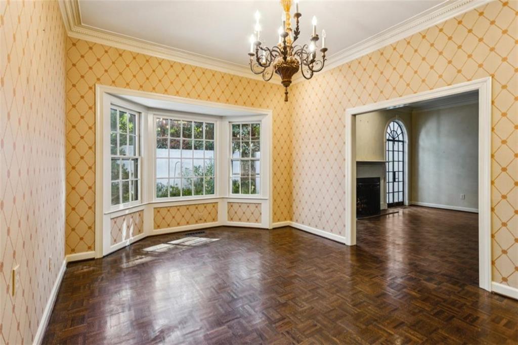 19 Mooregate Square Northwest Atlanta, GA 30327 - Photo 17 of 48 wooden floor in an empty room with a window