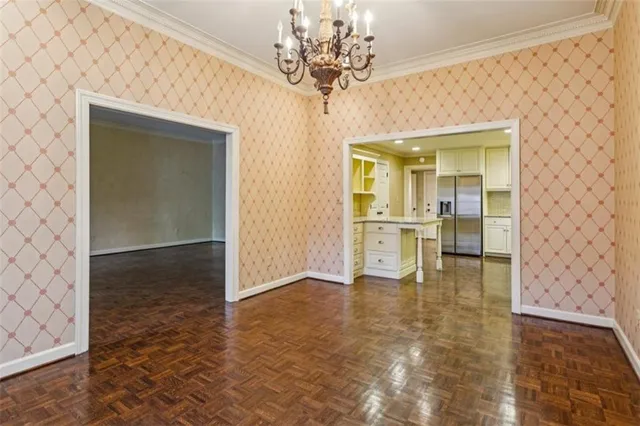 a kitchen with granite countertop cabinets stainless steel appliances and a sink