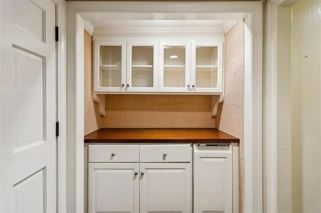 a bathroom with a toilet and a mirror