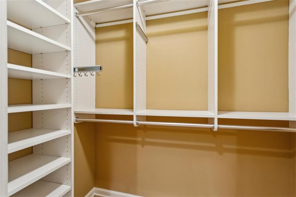 19 Mooregate Square Northwest Atlanta, GA 30327 - Photo 29 of 48 a view of walk in closet with empty racks
