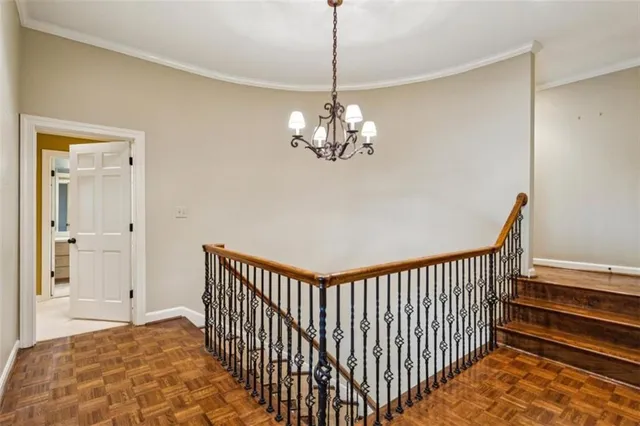 an empty room with a window and a ceiling fan