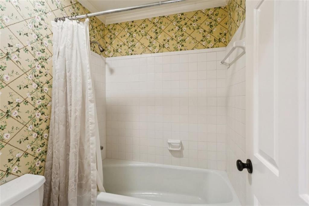 19 Mooregate Square Northwest Atlanta, GA 30327 - Photo 39 of 48 a bathroom with a shower curtain