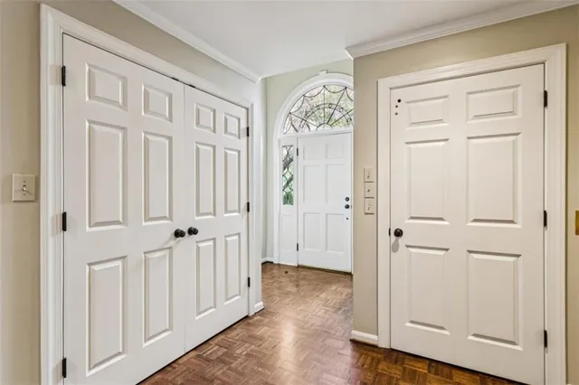 a view of staircase with wooden floor and a rug