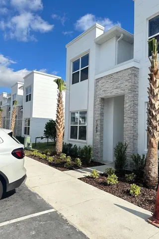 a front view of a house with yard