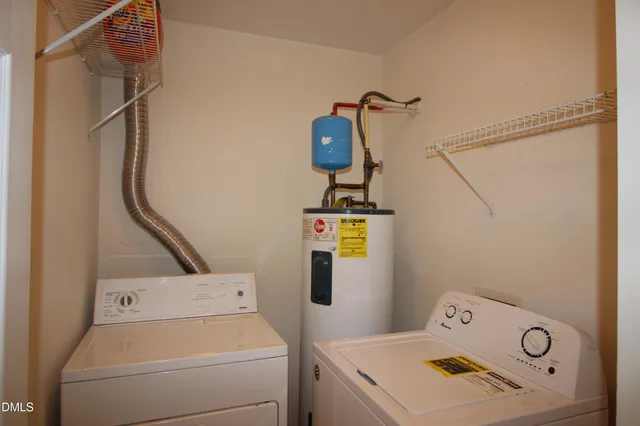 a view of storage and utility room with washer and dryer