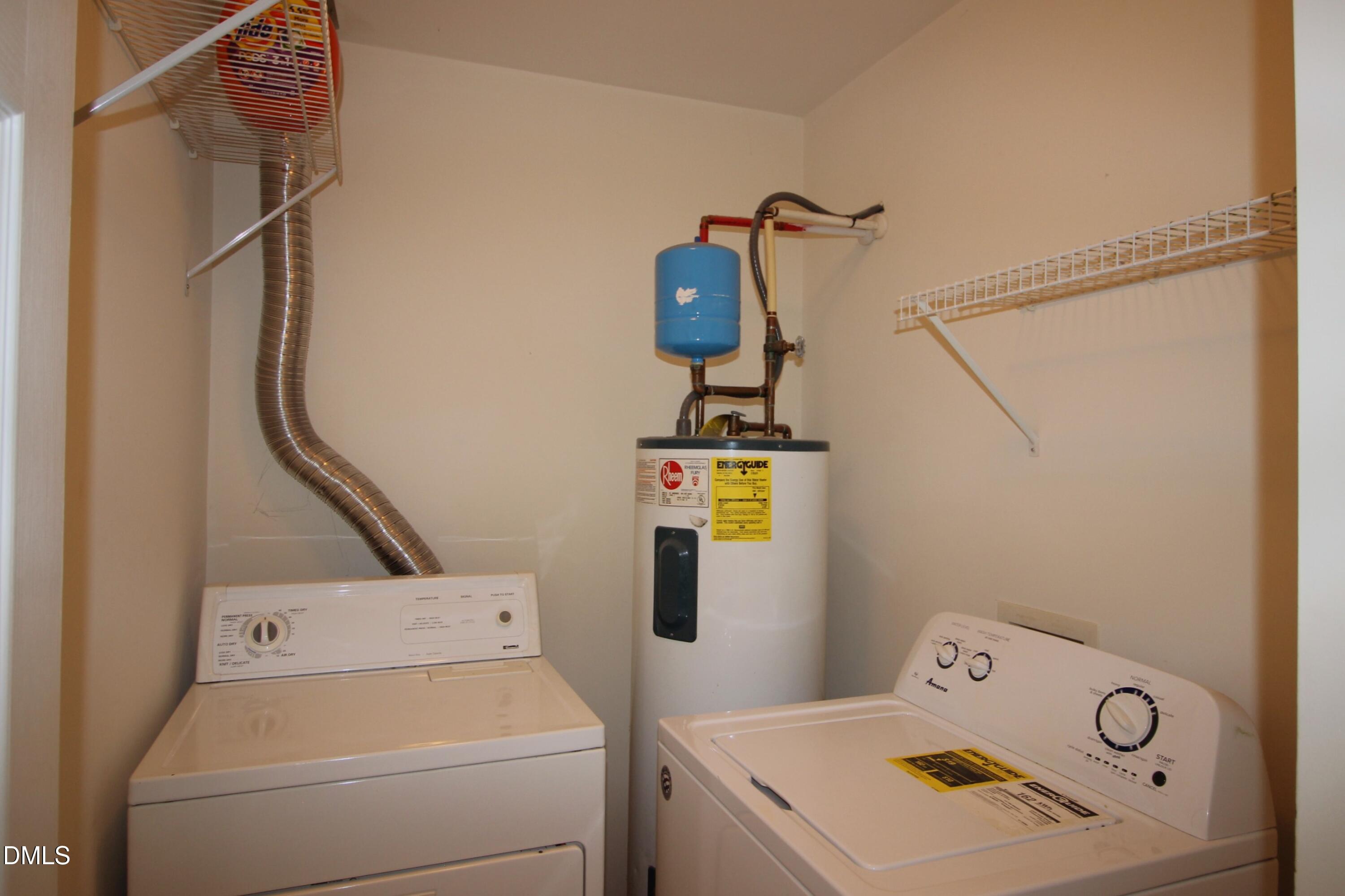 3030 Barrymore Street, Unit 109 Raleigh, NC 27603 - Photo 12 of 17 a view of storage and utility room with washer and dryer