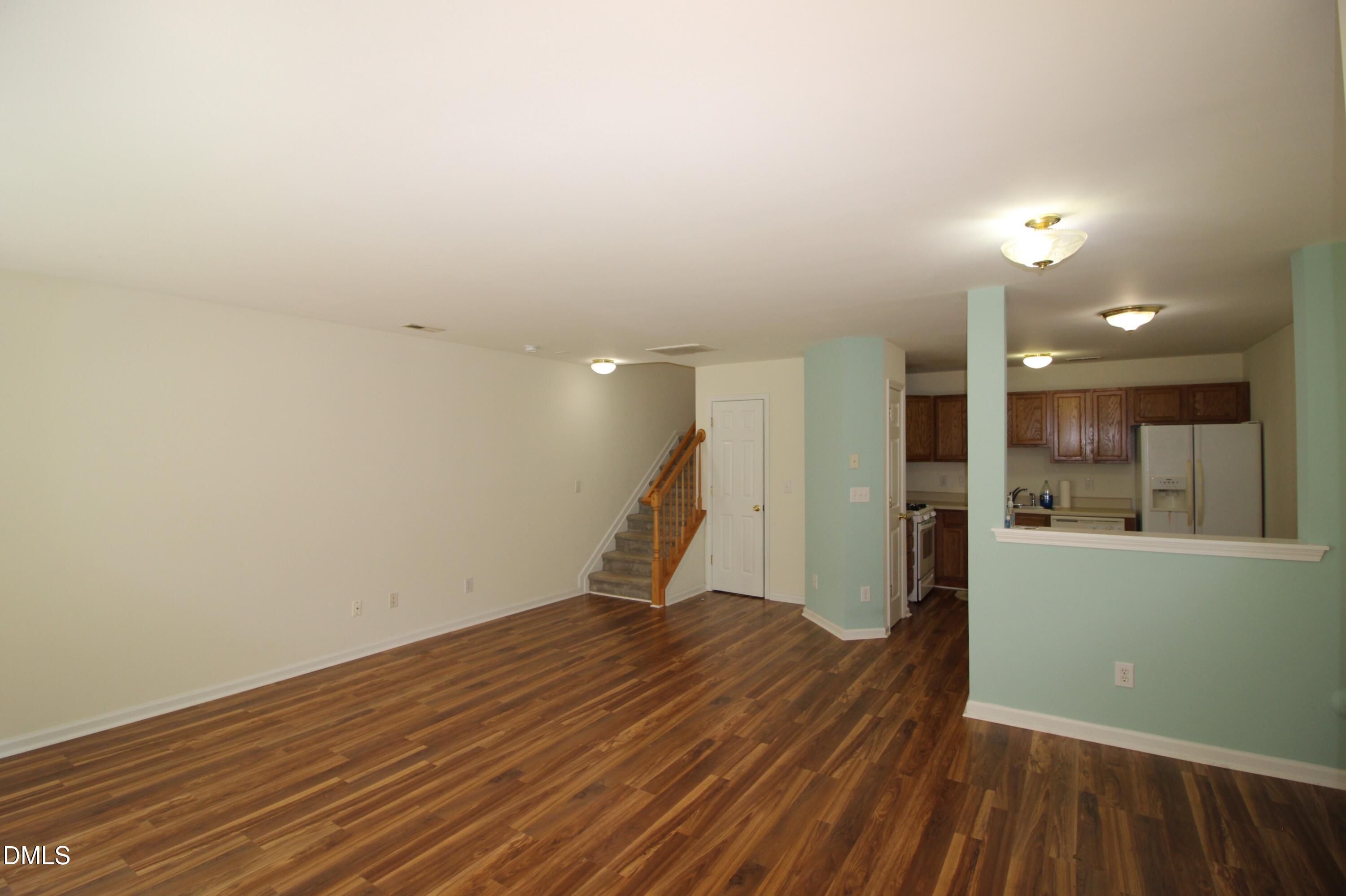 3030 Barrymore Street, Unit 109 Raleigh, NC 27603 - Photo 2 of 17 a view of a room with wooden floor and a sink
