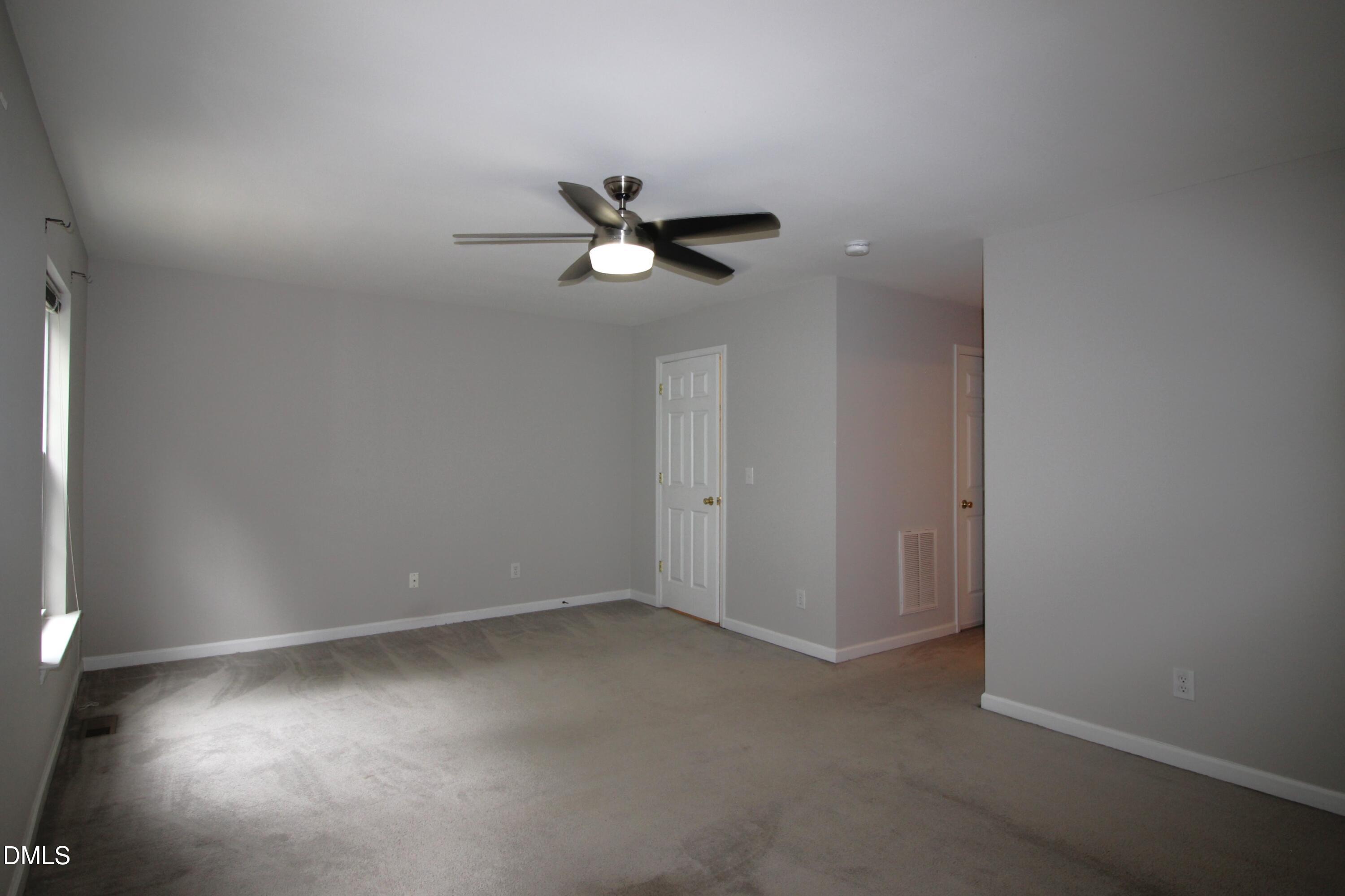 3030 Barrymore Street, Unit 109 Raleigh, NC 27603 - Photo 7 of 17 a view of room with a ceiling fan and a window