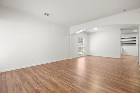 a view of a balcony with wooden floor