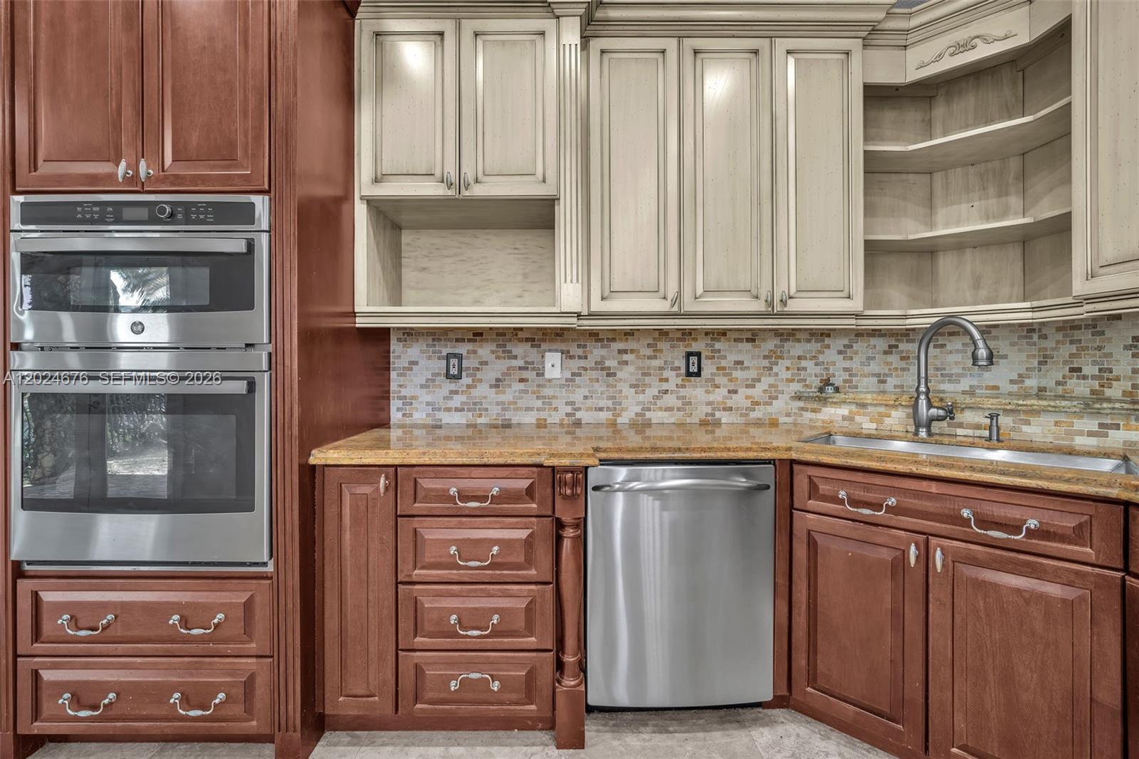 2155 Southwest 156th Court Miami, FL 33185 - Photo 25 of 57 a kitchen with stainless steel appliances granite countertop a sink and cabinets