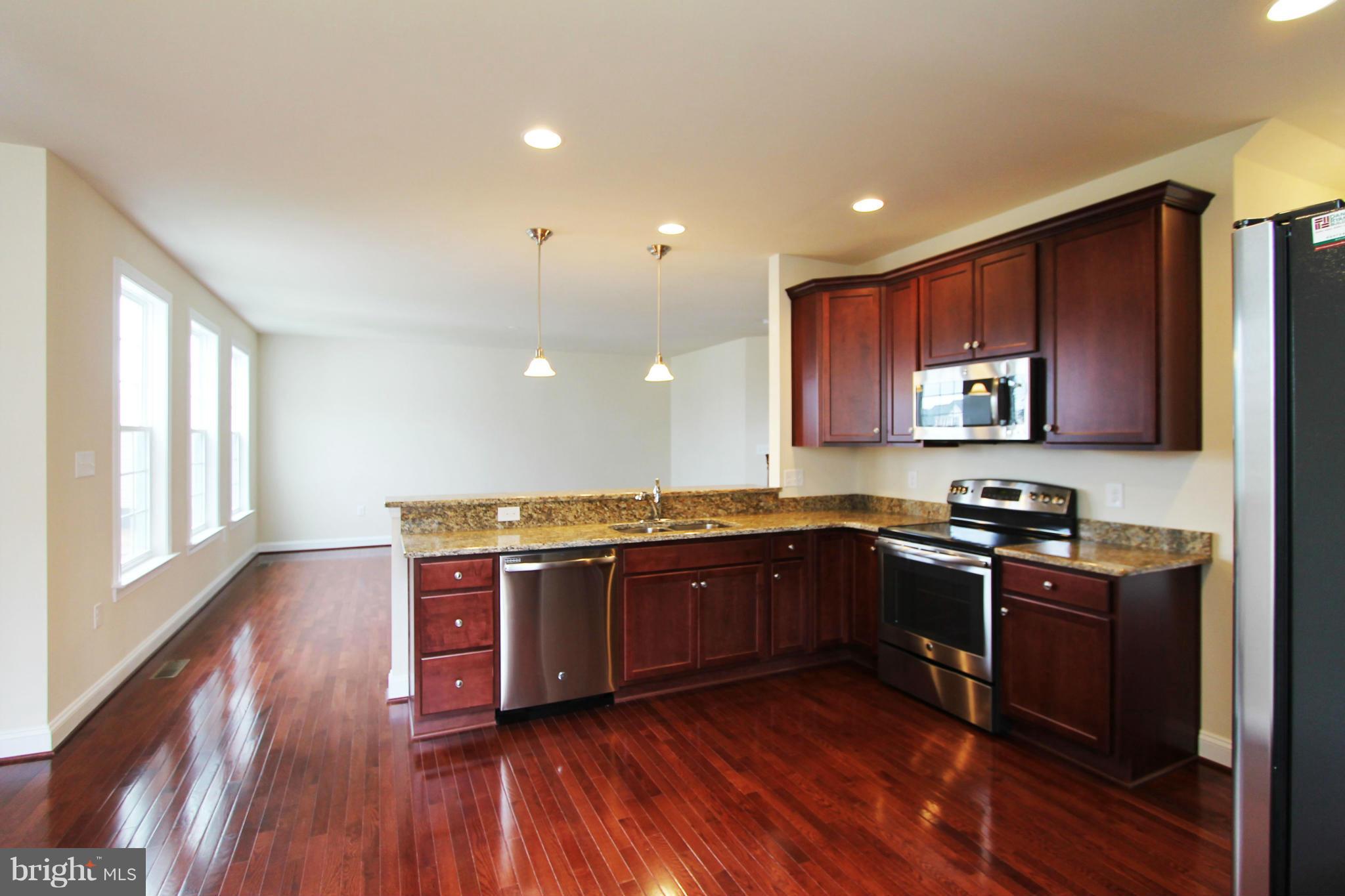 0 North Fairfax Boulevard Ranson, WV 25438 - Photo 9 of 30 Kitchen & Breakfast area to Family Room
