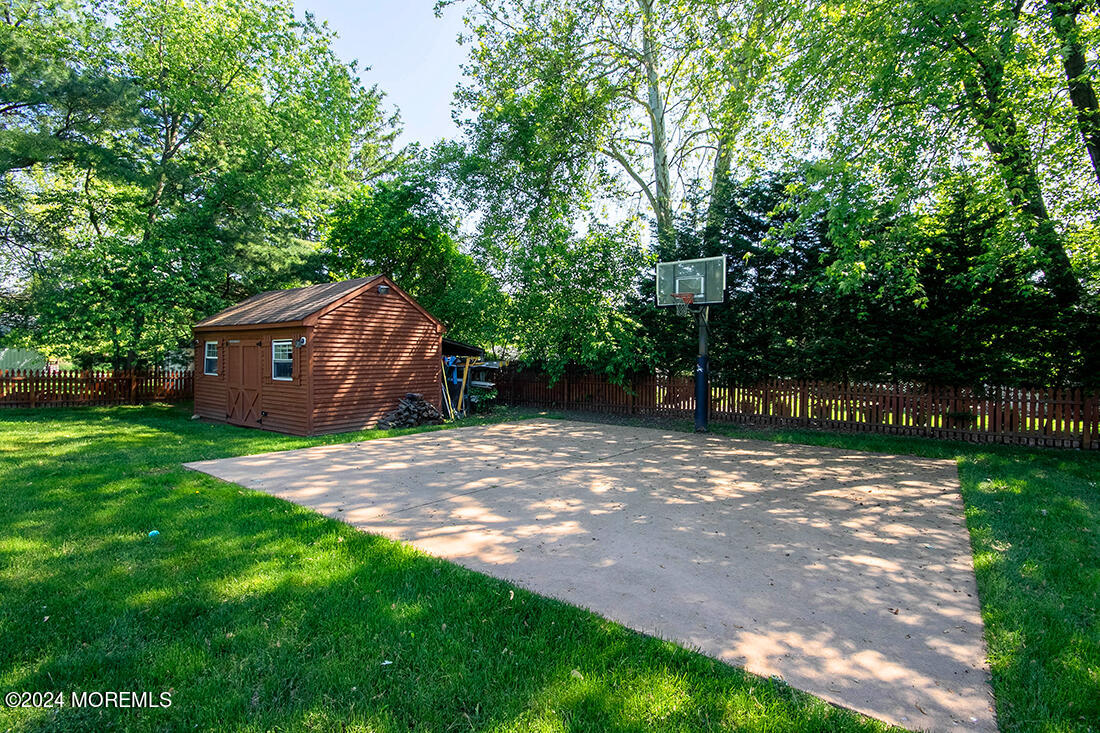 72 Vanderveer Road Freehold, NJ 07728 - Photo 12 of 53 a view of a barn in the middle of a yard