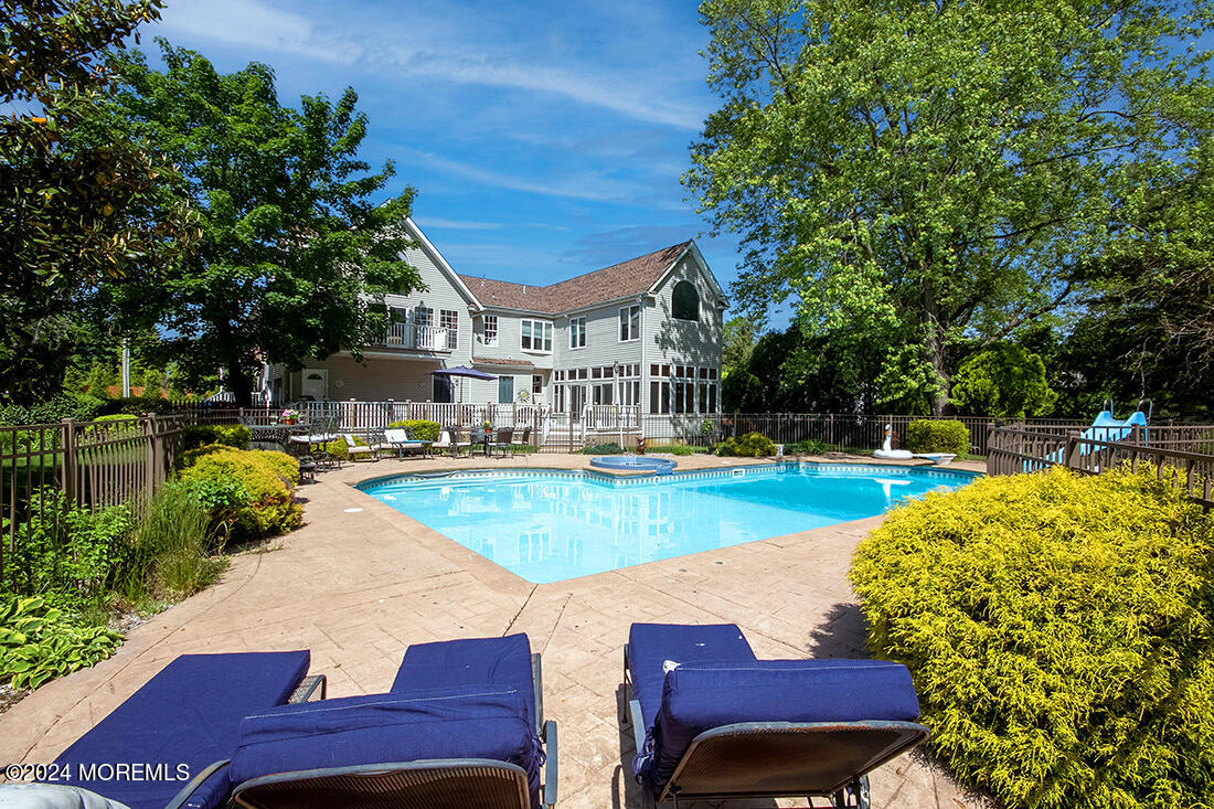 72 Vanderveer Road Freehold, NJ 07728 - Photo 13 of 53 a view of a swimming pool with a patio