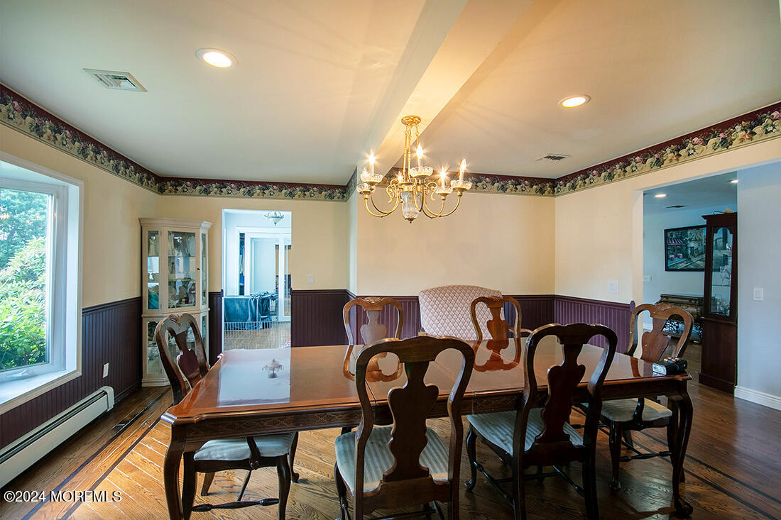 72 Vanderveer Road Freehold, NJ 07728 - Photo 17 of 53 a view of a dining room with furniture window and wooden floor