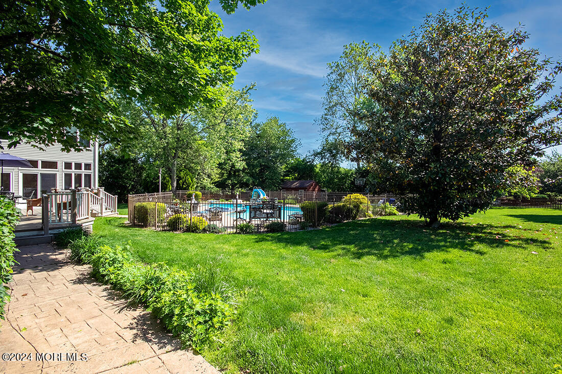 72 Vanderveer Road Freehold, NJ 07728 - Photo 2 of 53 a view of a chair and tables back yard of the house