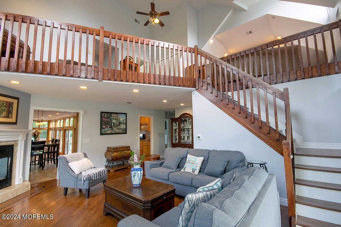 72 Vanderveer Road Freehold, NJ 07728 - Photo 21 of 53 a living room with furniture or wooden floor and a chandelier