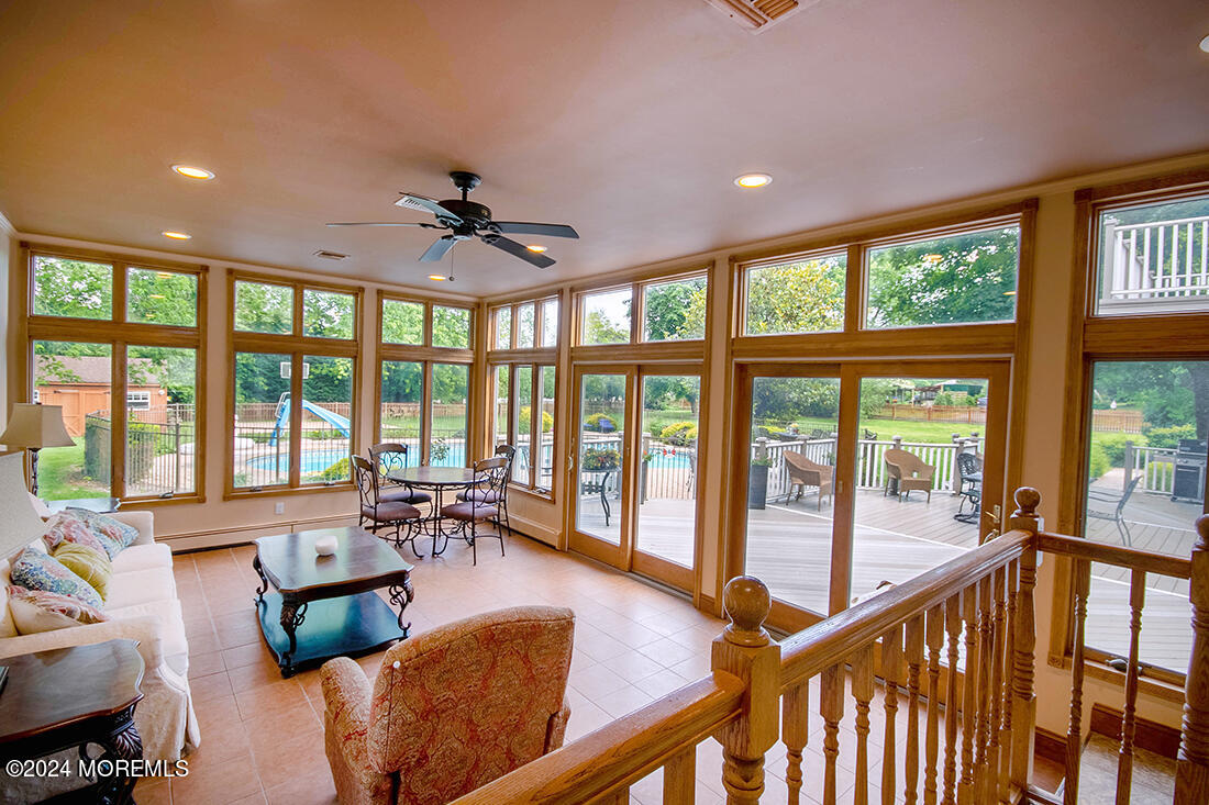 72 Vanderveer Road Freehold, NJ 07728 - Photo 25 of 53 a living room with furniture and floor to ceiling windows