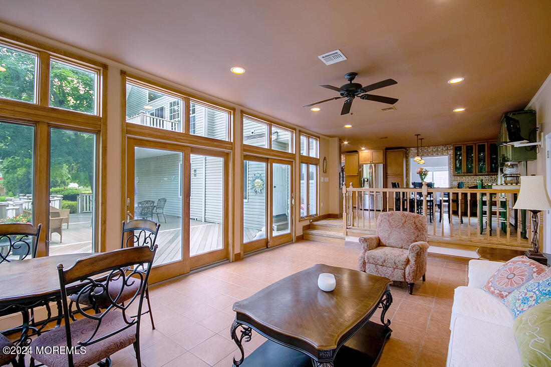72 Vanderveer Road Freehold, NJ 07728 - Photo 27 of 53 a living room with furniture a table and a large window