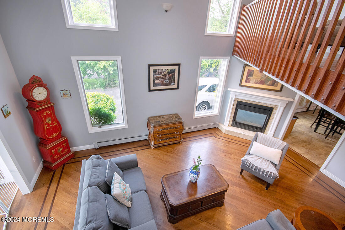 72 Vanderveer Road Freehold, NJ 07728 - Photo 28 of 53 a living room with furniture and a fireplace