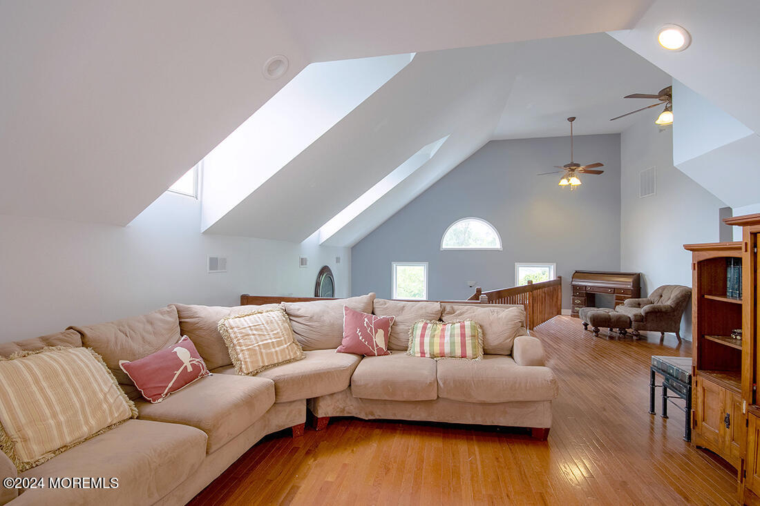 72 Vanderveer Road Freehold, NJ 07728 - Photo 29 of 53 a living room with furniture and wooden floor