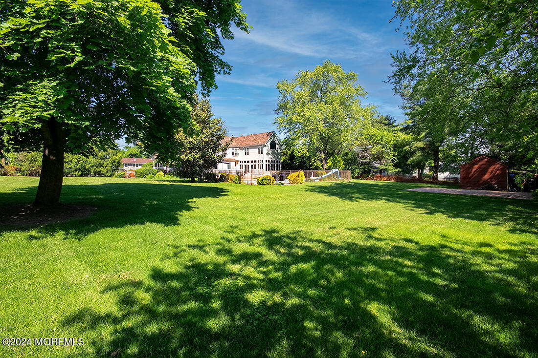 72 Vanderveer Road Freehold, NJ 07728 - Photo 3 of 53 a view of a park with large trees