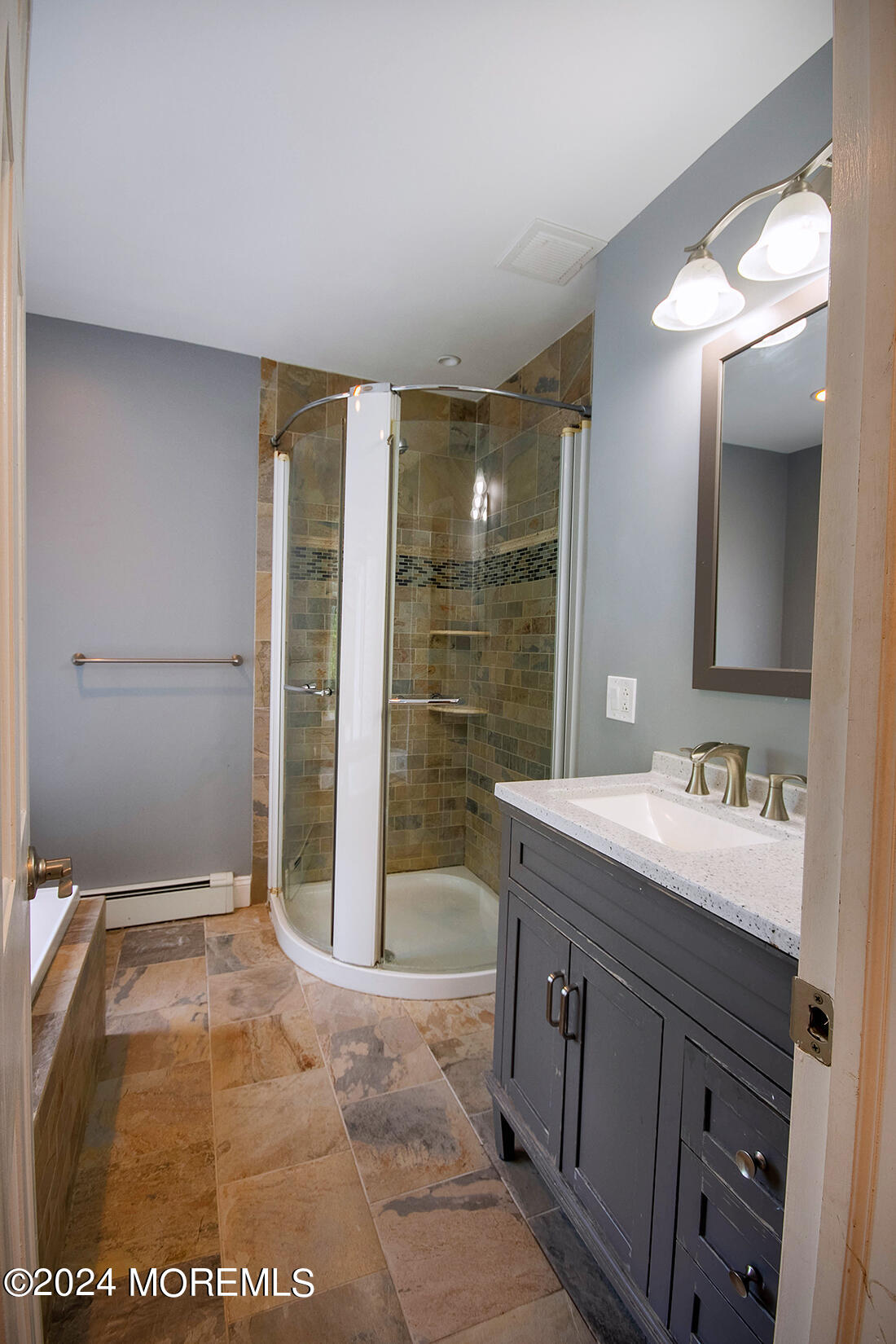 72 Vanderveer Road Freehold, NJ 07728 - Photo 36 of 53 a spacious bathroom with a mirror a sink and shower