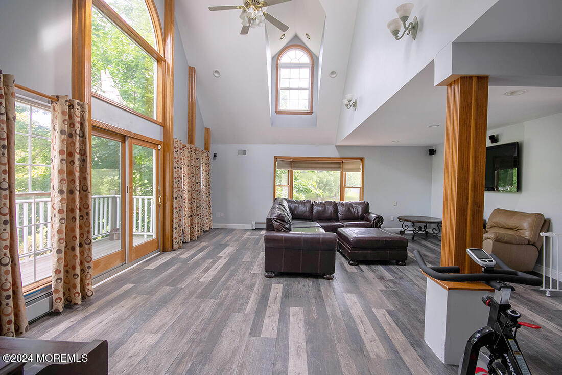 72 Vanderveer Road Freehold, NJ 07728 - Photo 41 of 53 a living room with furniture window and wooden floor