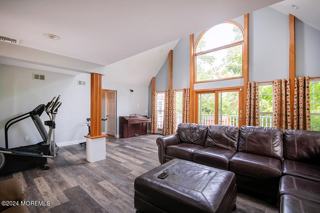 72 Vanderveer Road Freehold, NJ 07728 - Photo 46 of 53 a living room with furniture a flat screen tv and a large window