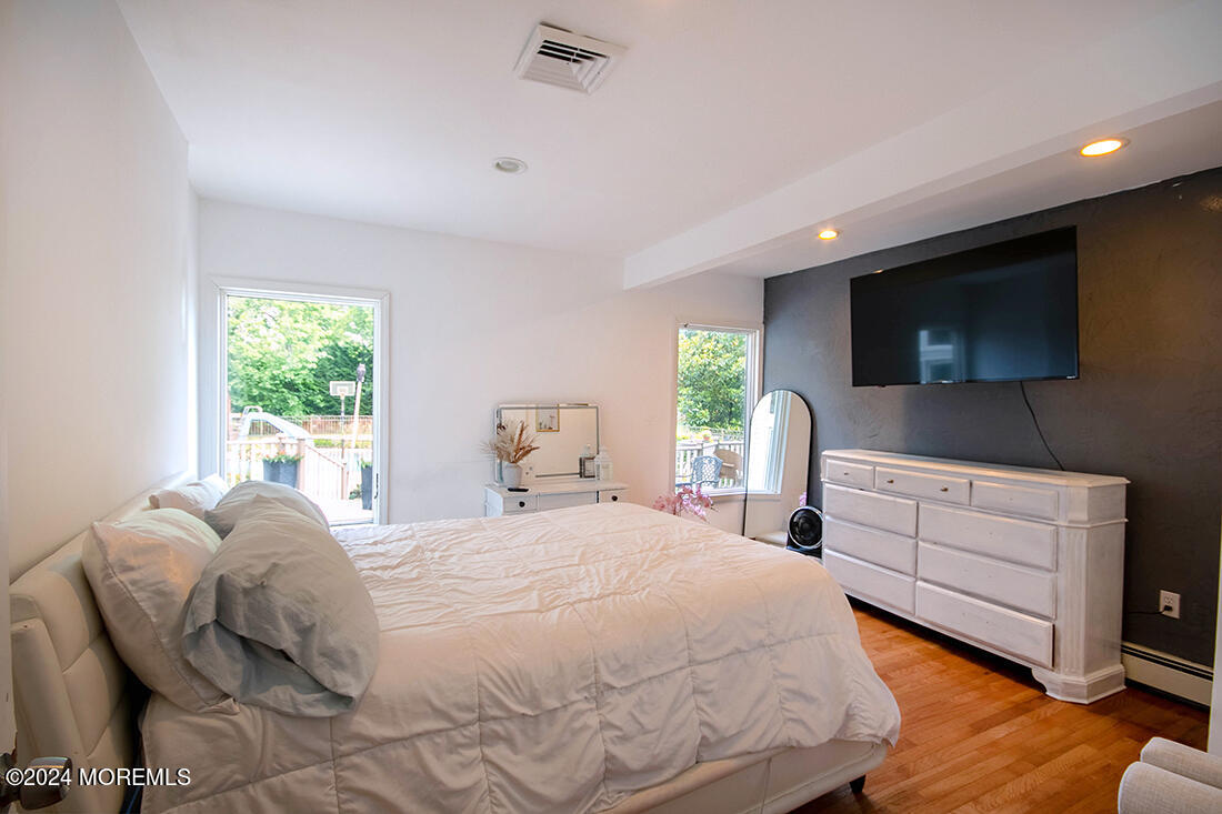 72 Vanderveer Road Freehold, NJ 07728 - Photo 47 of 53 a bedroom with a bed and a flat screen tv