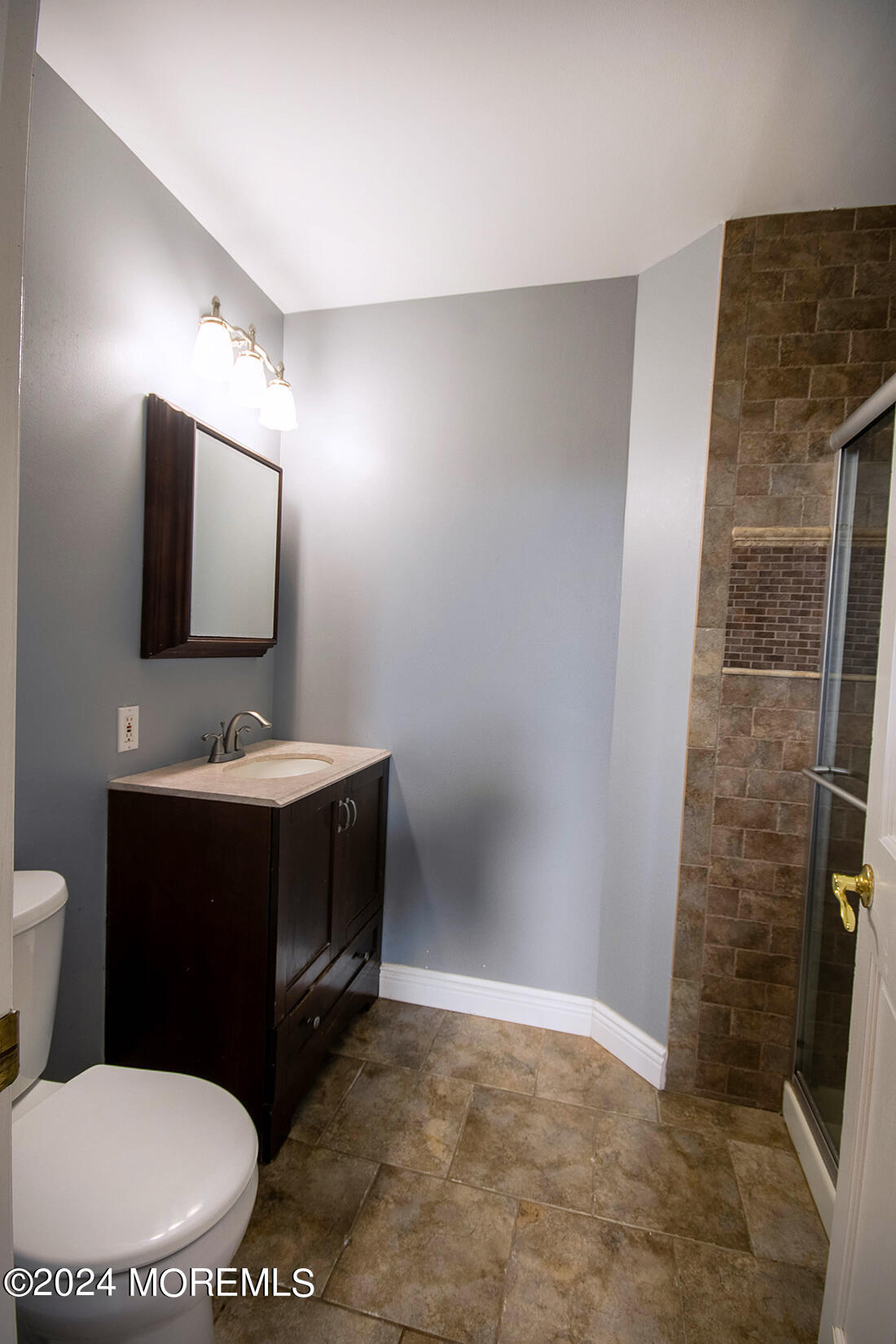 72 Vanderveer Road Freehold, NJ 07728 - Photo 48 of 53 a bathroom with a toilet a sink and mirror