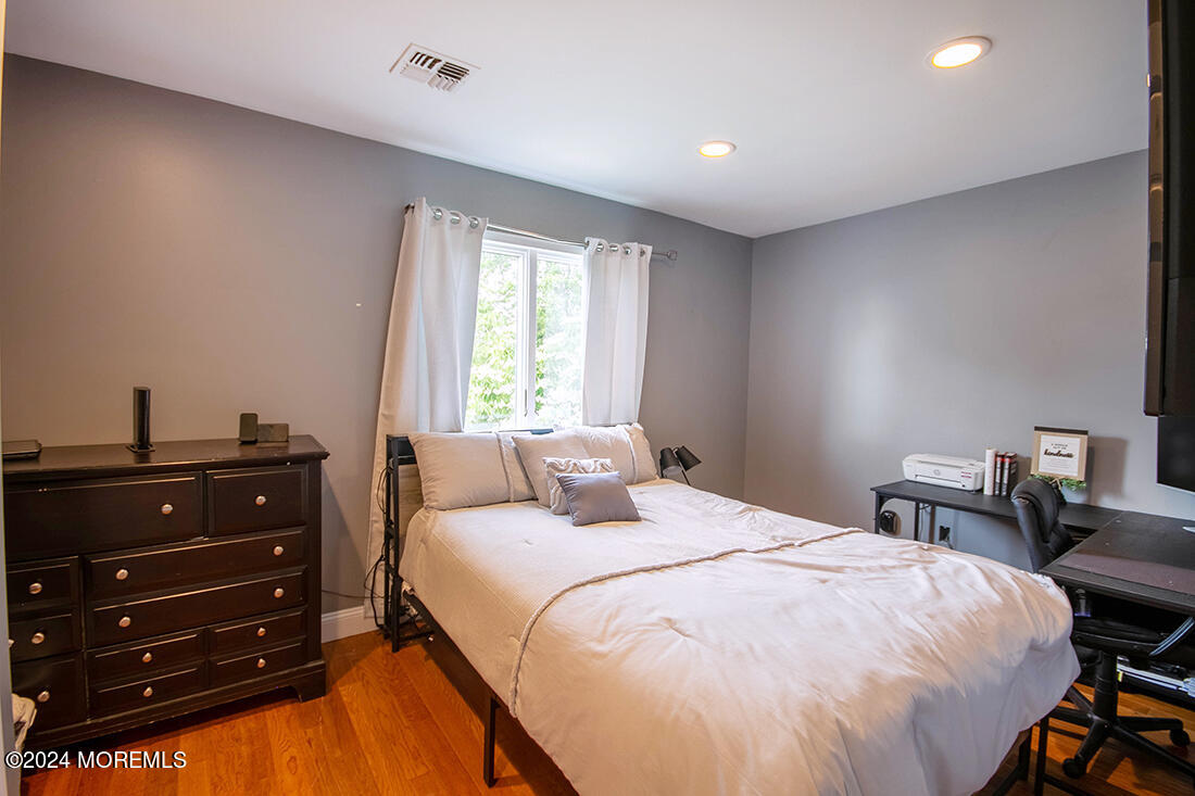 72 Vanderveer Road Freehold, NJ 07728 - Photo 49 of 53 a bedroom with a bed and a table