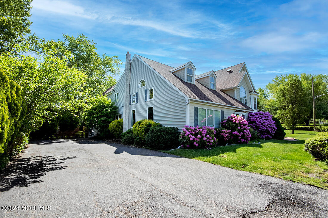 72 Vanderveer Road Freehold, NJ 07728 - Photo 5 of 53 a front view of a house with a garden
