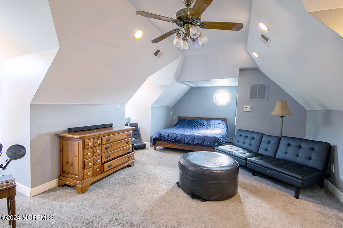 72 Vanderveer Road Freehold, NJ 07728 - Photo 51 of 53 a living room with furniture and a chandelier