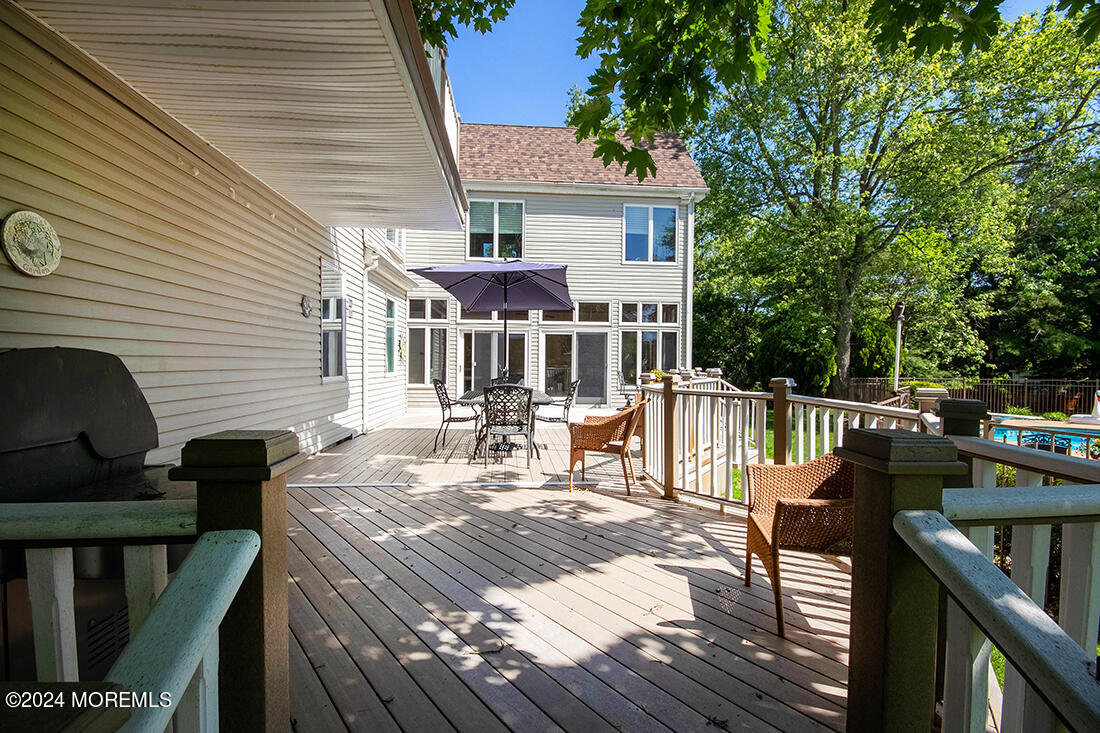72 Vanderveer Road Freehold, NJ 07728 - Photo 6 of 53 a view of a house with wooden deck and furniture