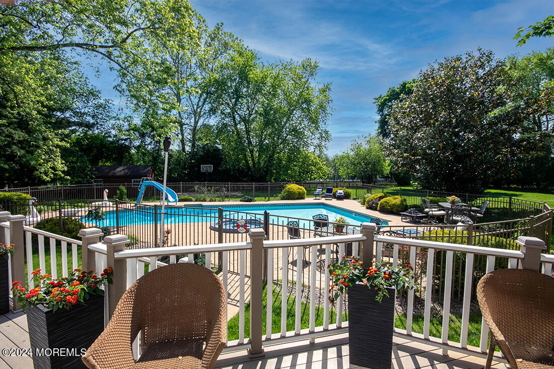 72 Vanderveer Road Freehold, NJ 07728 - Photo 8 of 53 a view of a chairs and table in the balcony