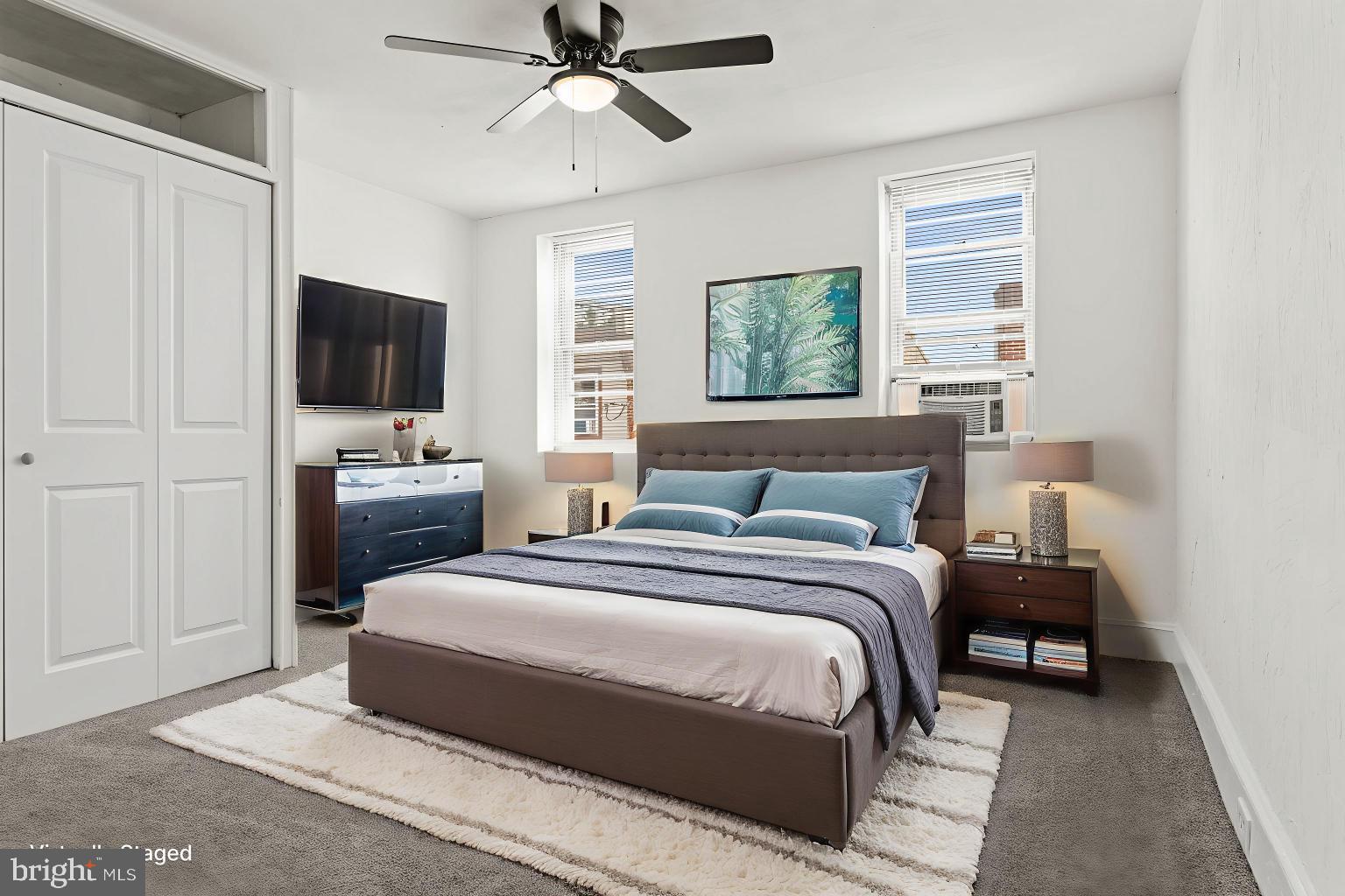 4474 Livingston Street Philadelphia, PA 19137 - Photo 13 of 27 a bedroom with a bed a window and a television