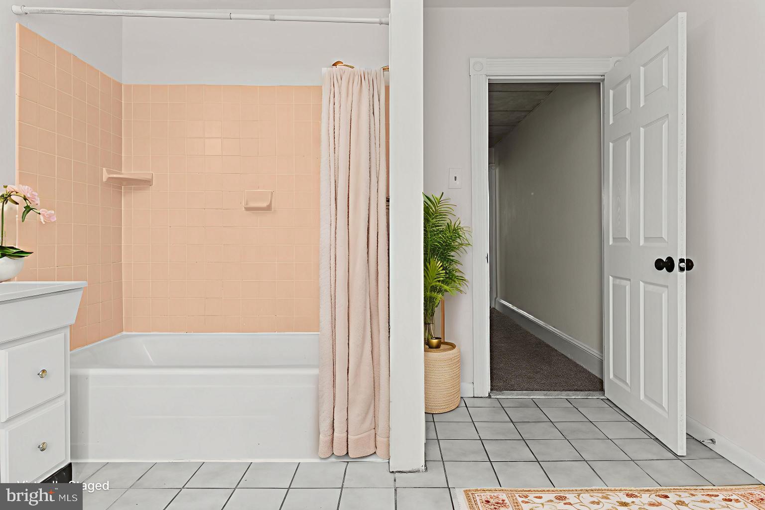 4474 Livingston Street Philadelphia, PA 19137 - Photo 20 of 27 a bathroom with a bathtub and a shower