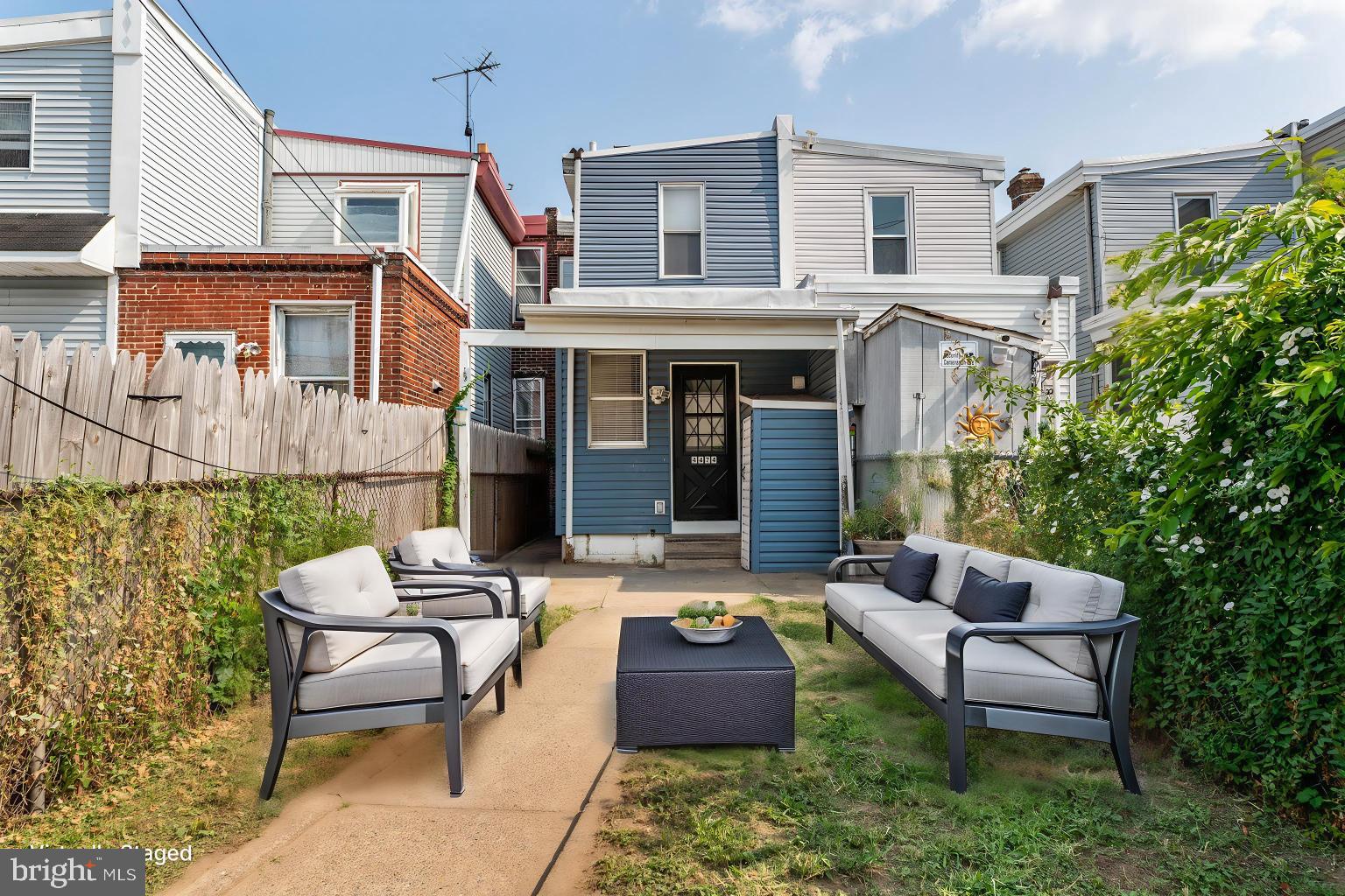 4474 Livingston Street Philadelphia, PA 19137 - Photo 24 of 27 a view of a patio with couches table and chairs and potted plants