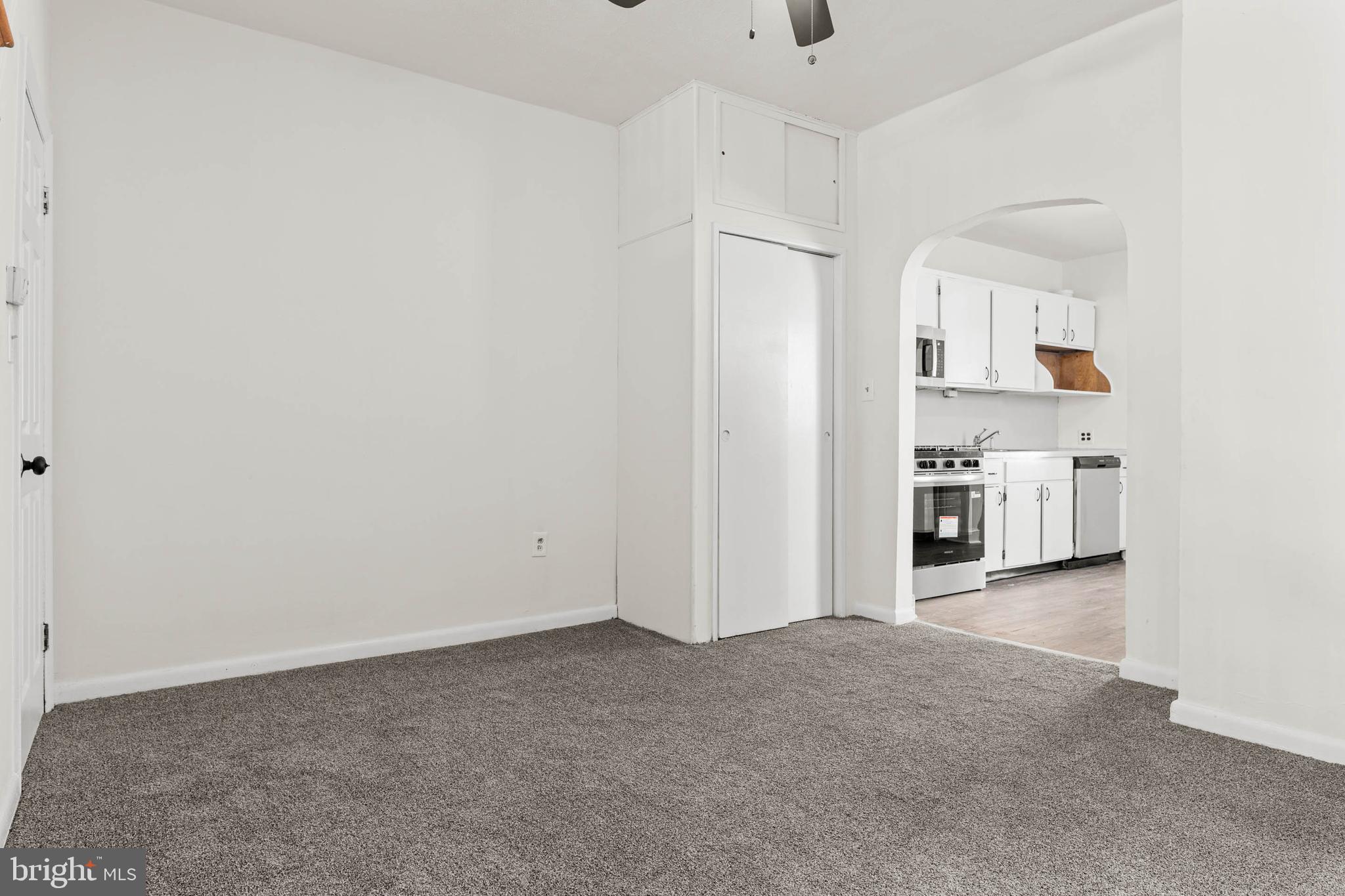 4474 Livingston Street Philadelphia, PA 19137 - Photo 6 of 27 a view of a kitchen with white cabinets and wooden floor