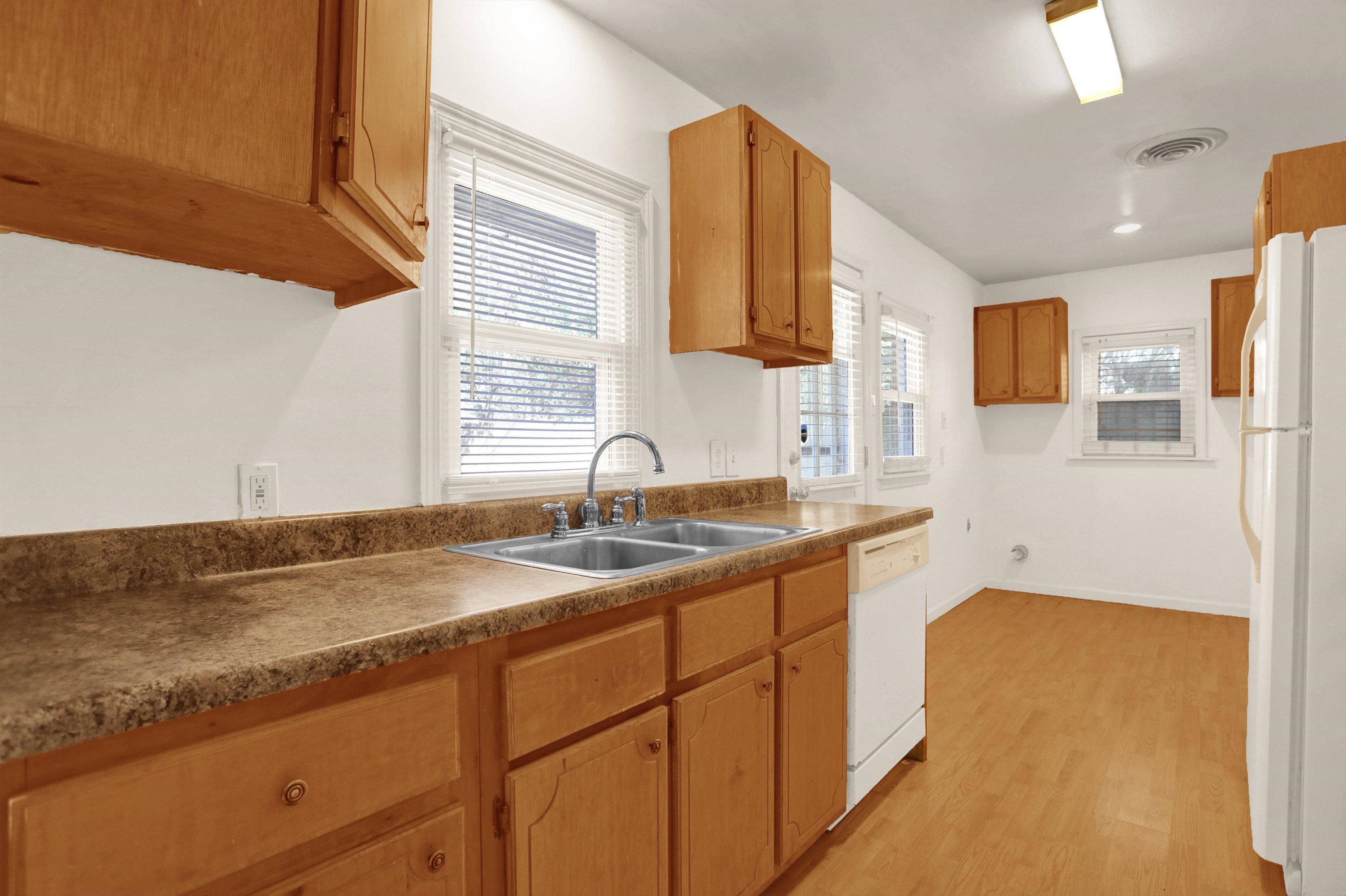 1459 Flamingo Road Memphis, TN 38117 - Photo 12 of 31 a kitchen with a sink cabinets and a granite counter top